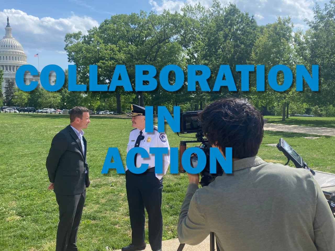 Executive Director Clark Mercer and retired Police Chief Tom Manger talk with the Capitol Building in the background.  