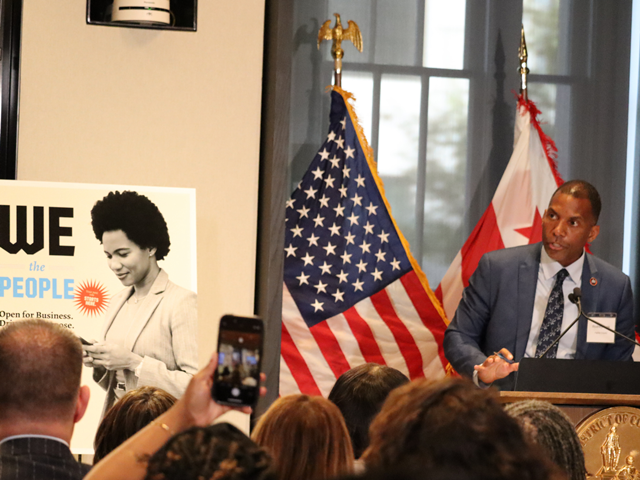 Lusk_speaks_at_a_podium_during_Talent_Capital_launch_event