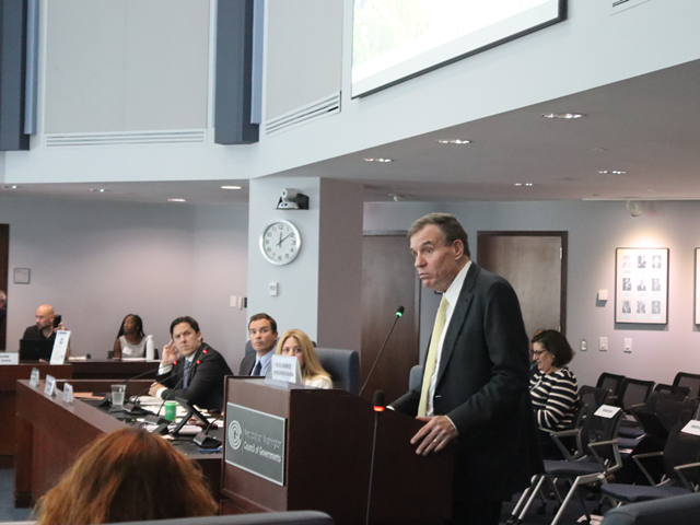 U.S. Senator Mark Warner addresses COG Board members from the podium