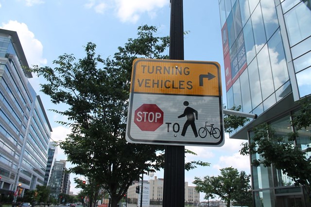 Vehicle yield to bicycle and pedestrians sign in northeast Washington, DC