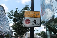 Vehicle yield to bicycle and pedestrians sign in northeast Washington, DC